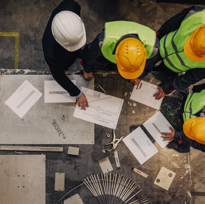 Workers and manager with documents